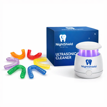 NightShield Dental ultrasonic cleaner with colorful mouthguards on a white background